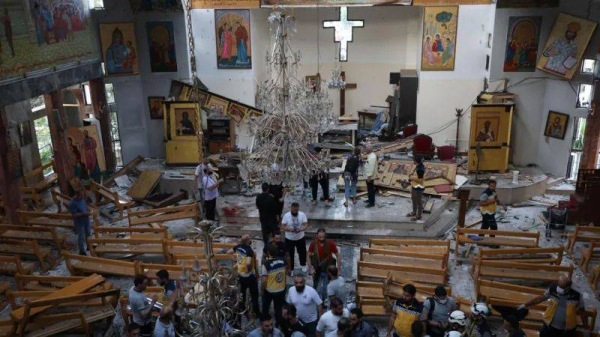 Pictures from inside Mar Elias Church show heavy damage and a bloodied floor