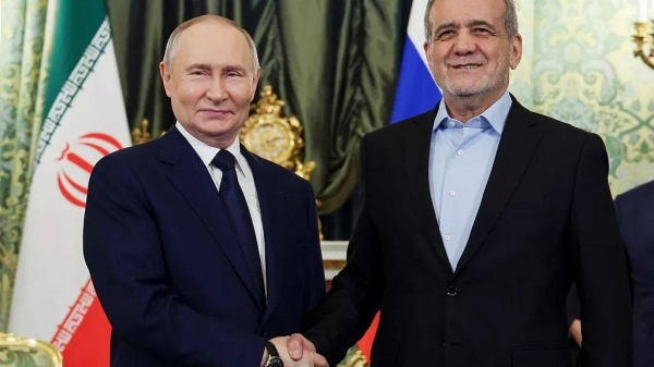 Russian President Vladimir Putin, left, and Iranian President Masoud Pezeshkian pose for a photo during their meeting at the Kremlin in Moscow, Russia, on Jan. 17, 2025