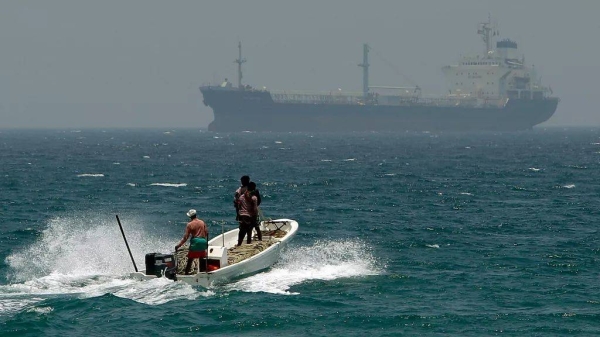In this file photo, fishermen cross the sea waters off Fujairah, United Arab Emirates, near the Strait of Hormuz