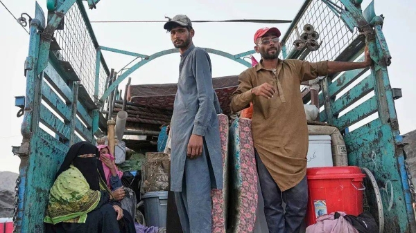 Repatriated Afghan refugees arrive at a camp after crossing the Pakistan-Afghanistan border in Torkham, 31 May, 2025
