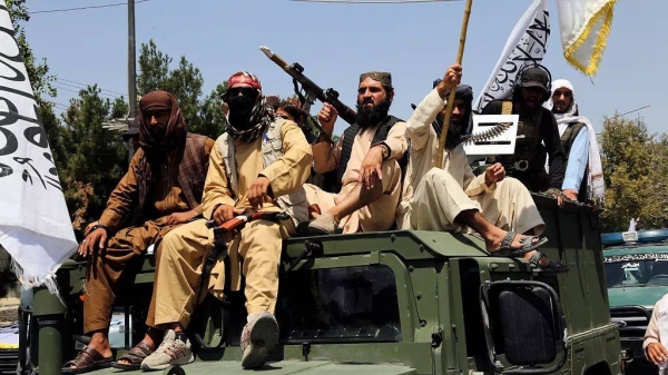 Taliban fighters celebrate the third anniversary of the withdrawal of US-led troops from Afghanistan, 14 August, 2024