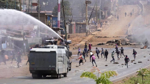 Riot police scatter protesters with water canons in the Kangemi slum of Nairobi, Kenya, Monday, July 7, 2025