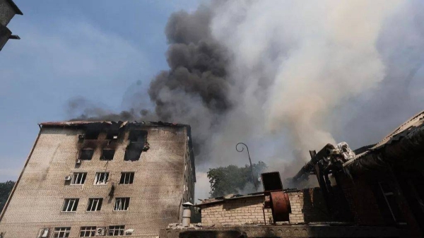Rescue workers put out a fire of a building destroyed by a Russian drone strike in Zaporizhzhia, Ukraine, on Monday, July 7, 2025