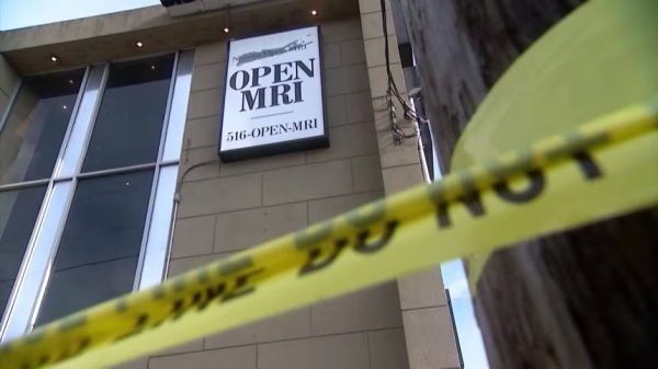 Police tape is seen outside Nassau Open MRI after a man was pulled into an MRI machine.