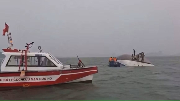 Survivors clung to the capsized tourist boat for hours before being rescued in Ha Long Bay, Vietnam on Saturday.