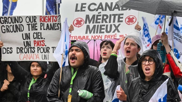 Air Canada employees and union members protest outside the Air Canada headquarters in Montreal, Sunday, Aug. 17, 2025