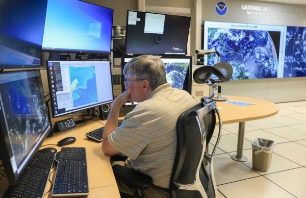 Jack Beven, senior hurricane specialist, tracks Erin on August 13 at the National Hurricane Center in Miami