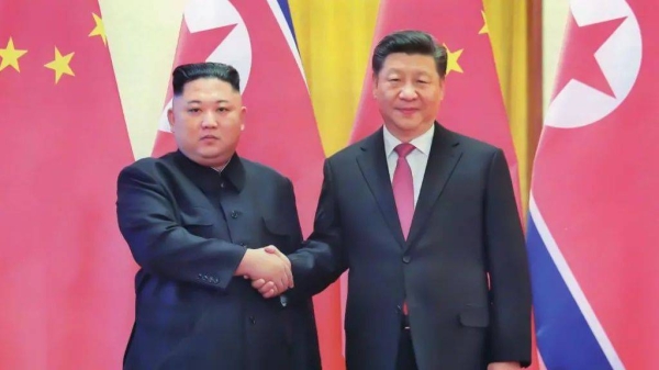 North Korean leader Kim (L) will be meeting Chinese leader Xi (R) in September