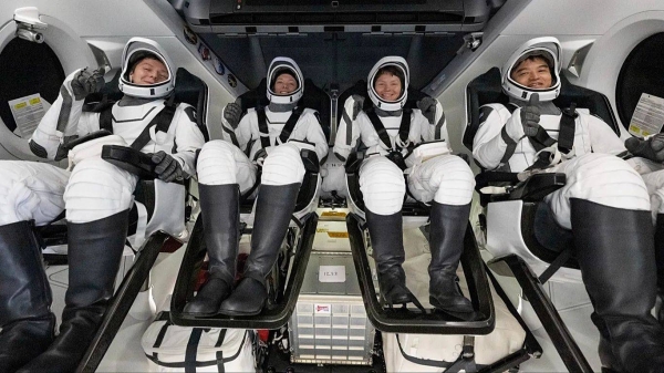 In this photo provided by NASA, a cosmonaut and astronauts are seen in a SpaceX spacecraft shortly after having landed in the Pacific Ocean near California on Aug. 9, 2025