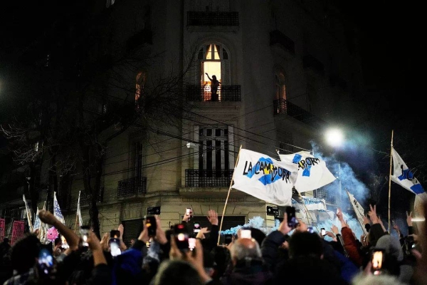 Cristina Fernandez waves to supporters from the balcony of her home after legislative provincial election polls closed, in Buenos Aires, Argentina, Sunday, Sept. 7, 2025