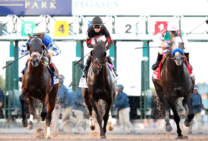 Mike Smith atop Arrogate (R) breaks the gate on their way to winning the $12 Million Pegasus World Cup Invitational at Gulfstream Park on Saturday in Hallandale, Florida. —AFP