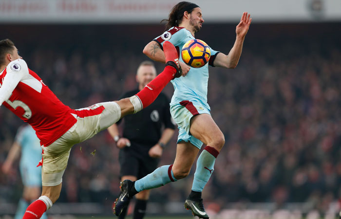 Burnley's George Boyd in action with Arsenal's Gabriel Paulista  during the Premier League match at the Emirates Stadium on Sunday. — Reuters