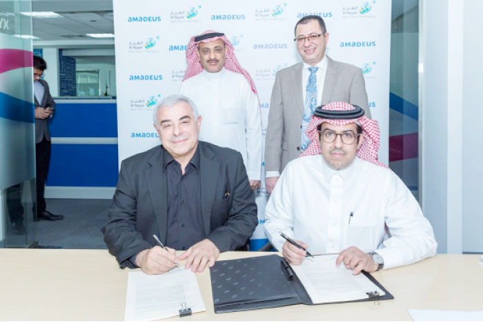 Senior executives of Al Tayyar Travel Group and Amadeus at the signing of agreement