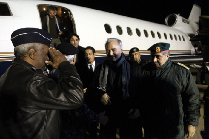 Marshal Khalifa Haftar (center), the military leader of the Libyan National Army and Libya’s parallel parliament based in the eastern city of Tobruk, is greeted upon his arrival at Al-Kharouba airport, about 80 km east of Benghazi on Tuesday after his visit to Russia. — AFP