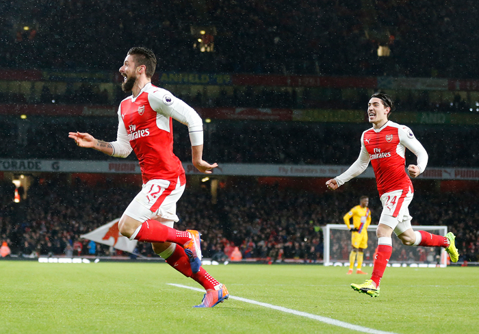 Arsenal's Olivier Giroud (L) celebrates after scoring during the English Premier League soccer match against Crystal Palace at the Emirates Stadium in London Sunday. — AP