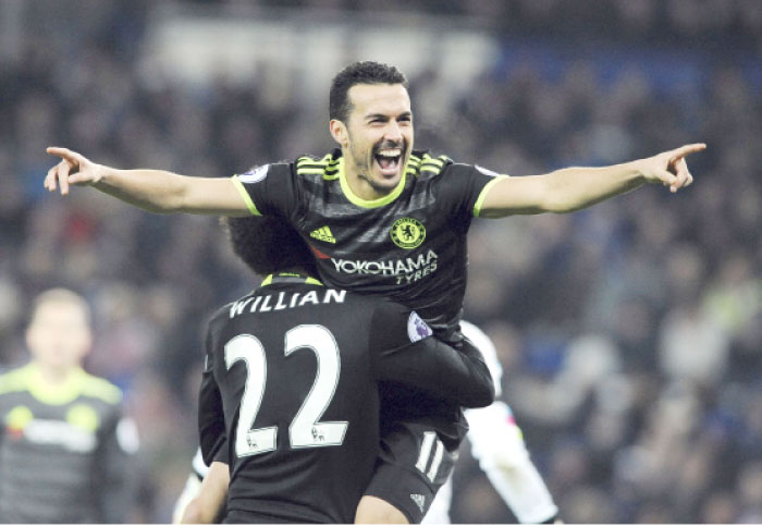 Chelsea’s Pedro celebrates scoring a goal during their English Premier League match against Leicester City in Leicester, England, Saturday. — AP