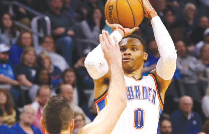 Oklahoma City Thunder’s Russell Westbrook shoots over Denver Nuggets’ Danilo Gallinari during their NBA game in Oklahoma City Saturday. — AP