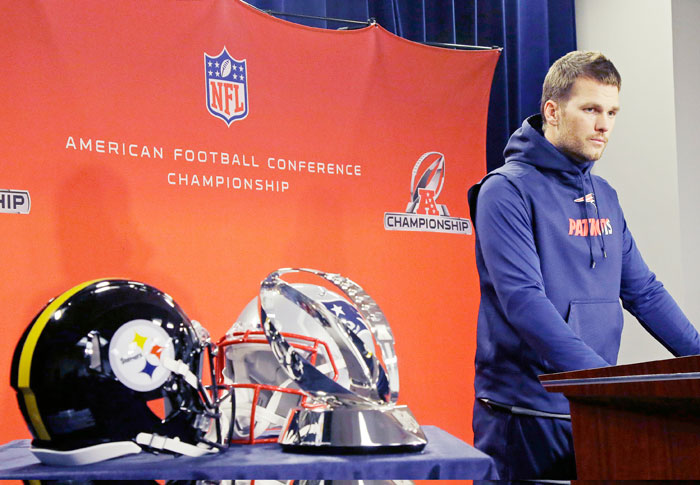 Sports_14_4New England Patriots quarterback Tom Brady listens during a news conference before an NFL football team practice, Wednesday, in Foxborough, Mass. The Patriots will host the Pittsburgh Steelers in the AFC championship game on Sunday. — AP