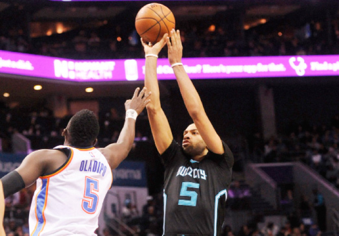 Charlotte Hornets’ guard forward Nicolas Batum takes a jump shot as he is defended by Oklahoma City Thunder’s guard Victor Oladipo during their NBA game at the Spectrum Center in Charlotte Wednesday. — Reuters