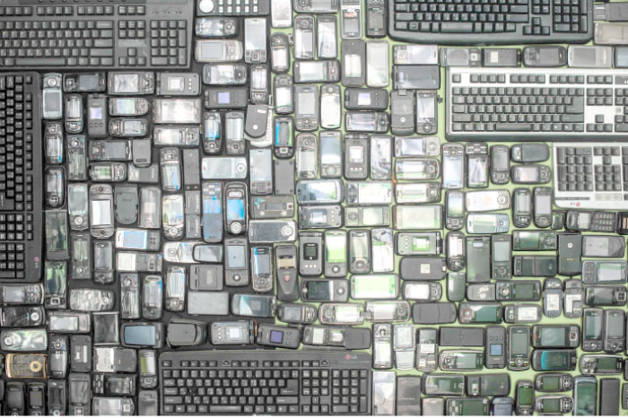 Discarded mobile phones and computer keyboards are displayed at the Metropolitan Electronics Recycling Center in Yongin, south of Seoul, on Saturday. — AFP