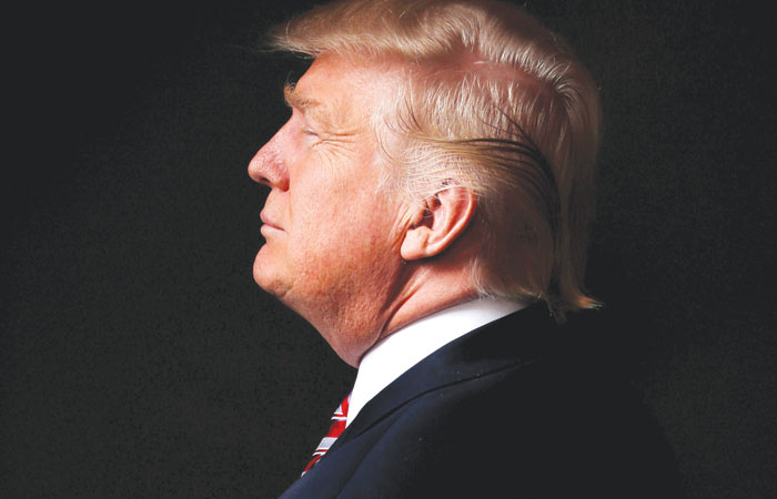 Donald Trump poses for a photo after an interview with Reuters in his office in Trump Tower, in the Manhattan borough of New York City. — Reuters