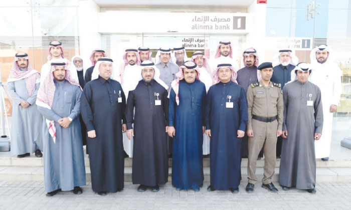 Mohammed Bin Abdullah Al-Assaf, the Mayor of Ar-Rass; Alinma Bank CEO Abdulmohsen Al-Fares, community and business leaders and other guests during the inaugural