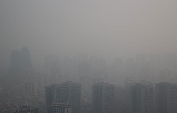 Buildings are seen among smog during a polluted day in Beijing, China, January 6, 2017. — Reuters