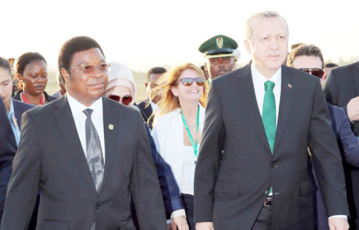 Tanzania’s Prime Minister Kassim Majaliwa (L) welcomes Turkish President Recep Tayyip Erdogan (R) upon his arrival at the airport in Dar es Salaam, on Sunday during a three-day tour to east Africa that will include visits to Mozambique and Madagascar.  — AFP