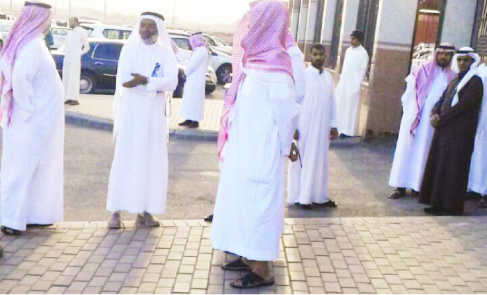 Some former employees of King Fahd Qur’an Printing Complex outside the Labor Office in Madinah seeking its intervention in the payment of their dues. — Okaz photo
