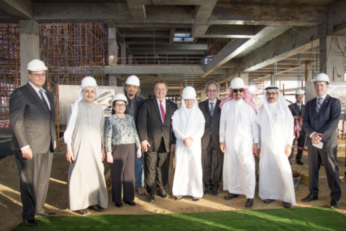Group picture of top officials at the 'Topping Out' ceremony for the Dow Middle East Innovation Center (MEIC)