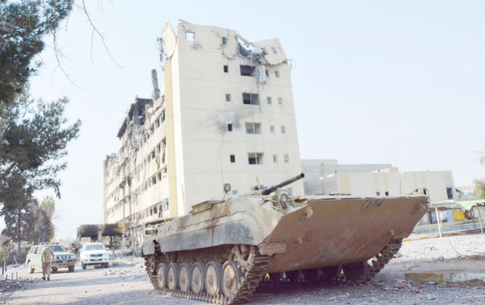 Iraqi forces drive a tank next to Al-Salam hospital after recapturing the area from the Daesh group during an ongoing military operation to recapture the city of Mosul. — AFP