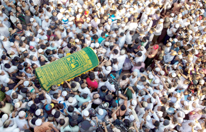 Mourners carry the coffin of Ko Ni, prominent Muslim lawyer who was shot dead on Sunday, at the Muslim cemetery in Yangon on Monday. — AFP
