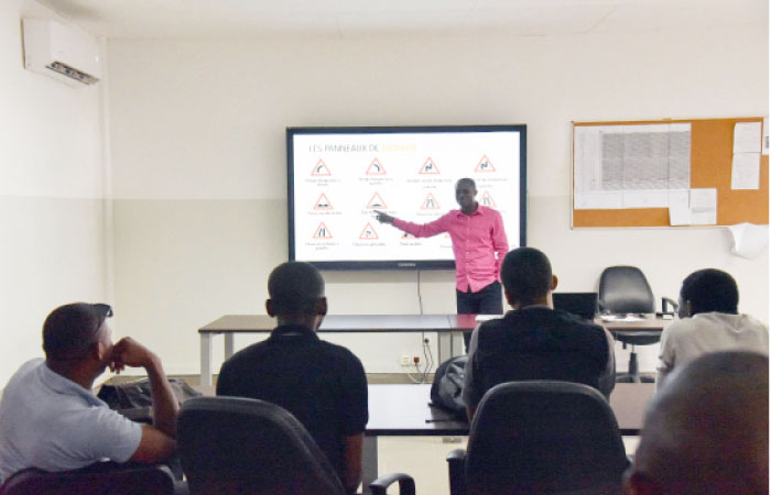 Taxi drivers of Africab follow a driving code lesson  at the company’s logistics base in Abidjan. — AFP