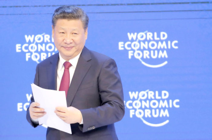 China’s President Xi Jinping smiles to the audience after his speech at the World Economic Forum in Davos, Switzerland, on Tuesday. — AP