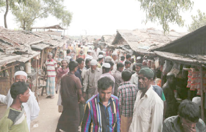Rohingya from Myanmar make their way in an alley at an unregistered refugee camp in Teknaf, near Cox’s Bazar, a southern coastal district about, 296 km south of Dhaka, Bangladesh, in this Dec. 2, 2016 file photo. — AP