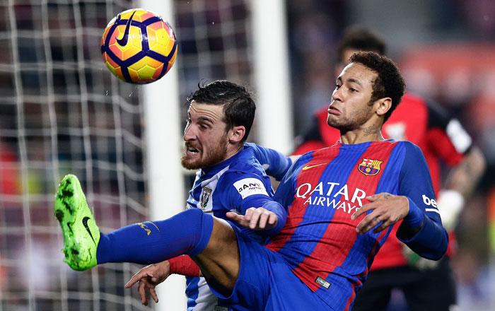 Barcelona's Neymar, right, duels for the ball against Leganes' Roberto Tito Roman during the Spanish La Liga soccer match between Barcelona and Leganes at the Camp Nou stadium in Barcelona on Sunday — AP