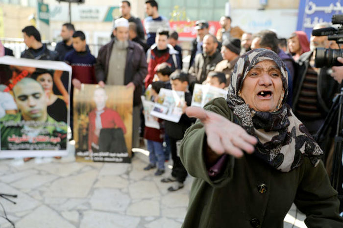 A Palestinian woman reacts during a protest following the sentencing of Israeli soldier Elor Azaria, in the West Bank City of Hebron. — Reuters