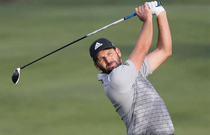 Sergio Garcia of Spain plays a shot on the 10th hole during the 1st round of the Dubai Desert Classic Golf Tournament Thursday. —AP