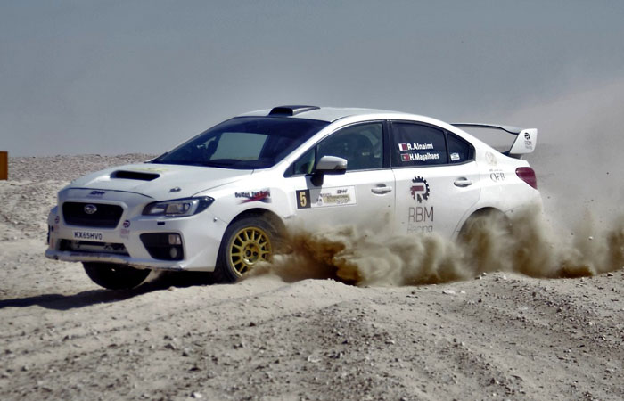 Rashed Al-Naimi and co-driver Hugo Magalães heading toward victory in the QMMF Qatar International Rally Saturday.