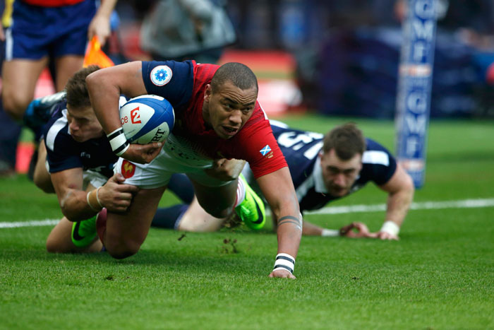 France's Gael Fickou scores a try as Scotland's Huw Jones (R) and Stuart Hogg try to stop him during their Six Nations Championship match at Stade de France, Saint-Denis near Paris Sunday. — Reuters