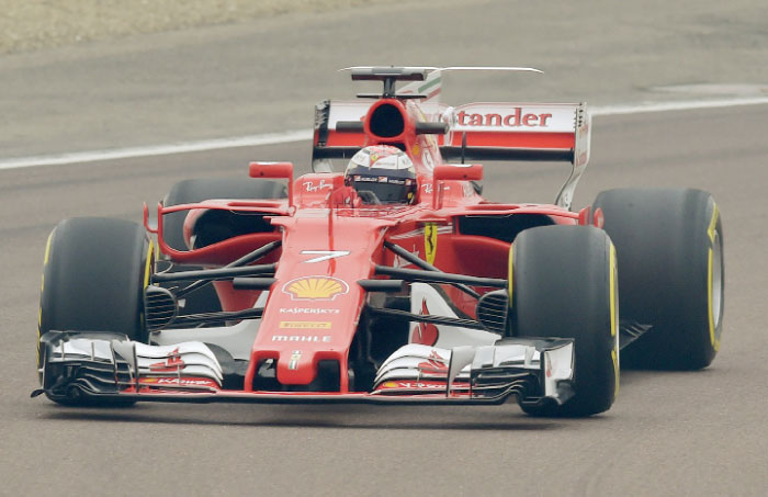 Kimi Raikkonen steers the new Ferrari Formula 1 SF70H racer at the Ferrari Fiorano private test track in Maranello, Italy, Friday. — AP
