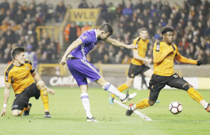 Chelsea’s Diego Costa shoots against Wolverhampton Wanderers during their FA Cup fifth round match in Molineux Saturday. — Reuters