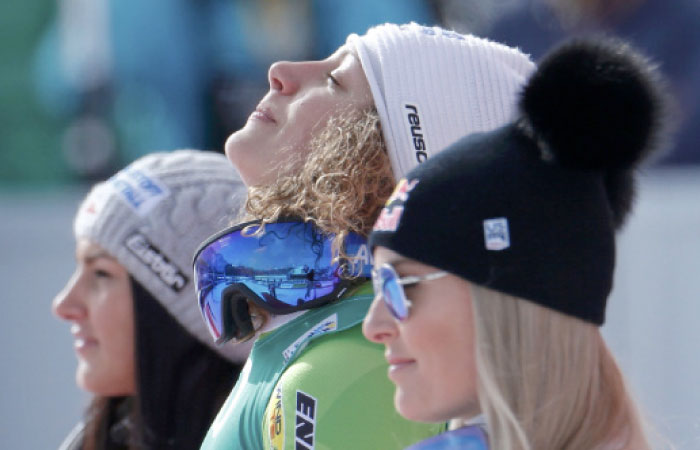 Gold medalist Ilka Stuhec of Slovenia is flanked by Austria’s silver medalist Stephanie Venier (L) and bronze medalist Lindsey Vonn of the US at the FIS Alpine Skiing World Championships in St. Moritz, Switzerland, Sunday. — Reuters