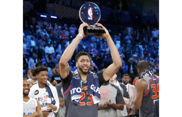 Western Conference forward Anthony Davis of the New Orleans Pelicans (23 ) holds up his MVP trophy after the NBA All-Star basketball game in New Orleans, Sunday. — AP