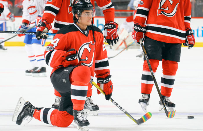 Joseph Blandisi No. 64 of the New Jersey Devils skates in warm-ups prior to the game against the Montreal Canadiens with his stick decorated for “Hockey is for Everyone” pride night at the Prudential Center on Monday in Newark, New Jersey. — AFP