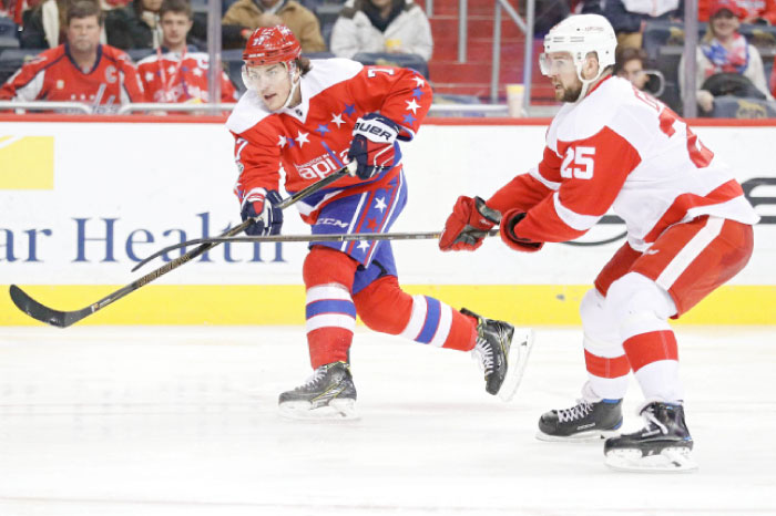 T.J. Oshie (L) of the Washington Capitals scores a goal in front of Mike Green of the Detroit Red Wings during their NHL game at Verizon Center in Washington Thursday. — AFP