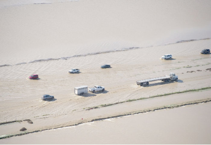 Flood water crosses over Interstate 5 at Williams backing up traffic in both north and southbound lanes for hours in Williams, California, on Saturday. — AP