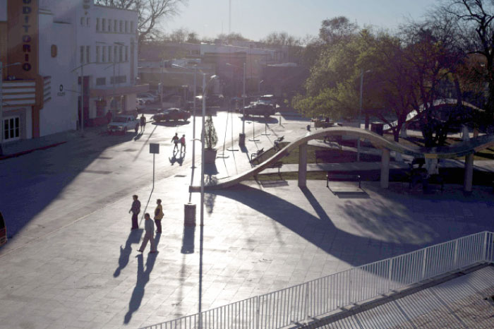 People walk on the US/Mexico border in Piedras Negras, northern Mexico, on Tuesday. — AFP