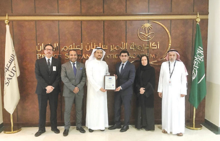 Capt. Badr A. Alolayan, Managing Director of Prince Sultan Aviation Academy receives the ISO 9001:2015 Certificate from Samir Ahmed, General Manager of Intertek Saudi Arabia Business Assurance Division, during a handover ceremony held at PSAA office in Jeddah, in the presence of Captain Abdulmoghni Althubaiti, Director Training PSAA; Essam Sabir, Manager Audit & Quality Assurance (D) PSAA;  Zeinab Ibrahim, Senior Auditor PSAA; and Hesham Abbas, Area Manager Intertek BA Saudi Arabia Western Region
