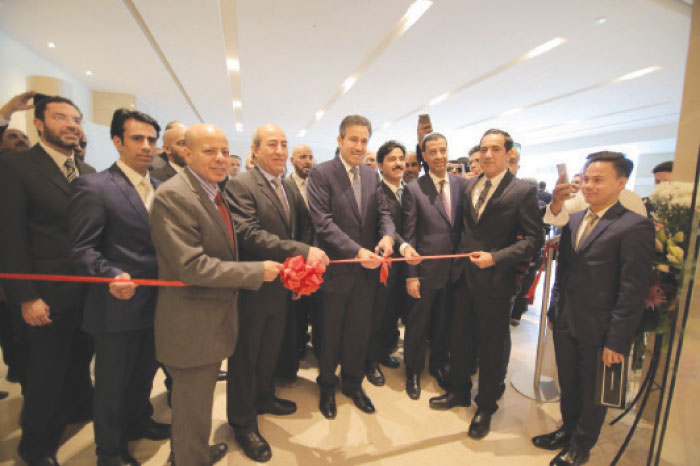 Saudia Director General Saleh Al-Jasser cuts the ceremonial ribbon of the first international Al-Fursan lounge at Cairo International Airport, assisted by Airport Company Board President Megdi Ishaq and several other senior officials. Some diplomats also attend the ceremony